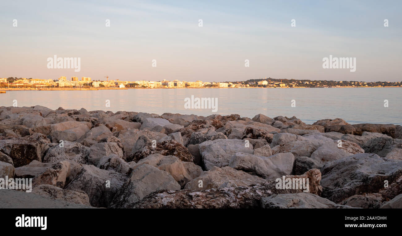 view on Antibes and Juan-les-Pins at sunset on the Mediterranean sea shore in winter Stock Photo