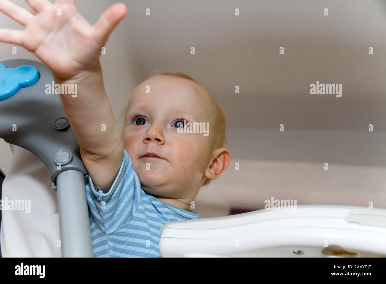Photo of the One year Baby watching cartoons on TV and playing Stock