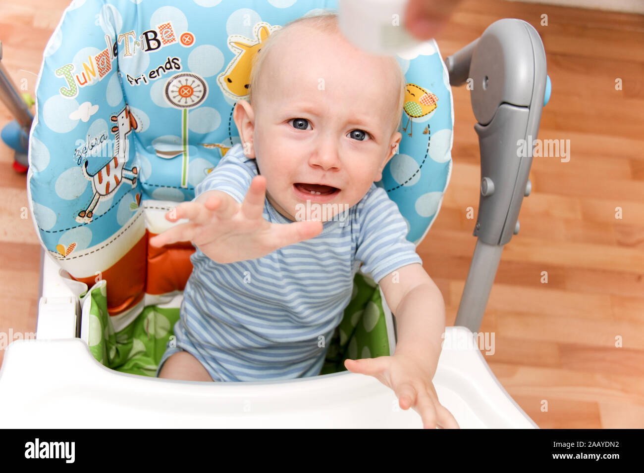 Photo of the One year Baby watching cartoons on TV and playing Stock Photo  - Alamy