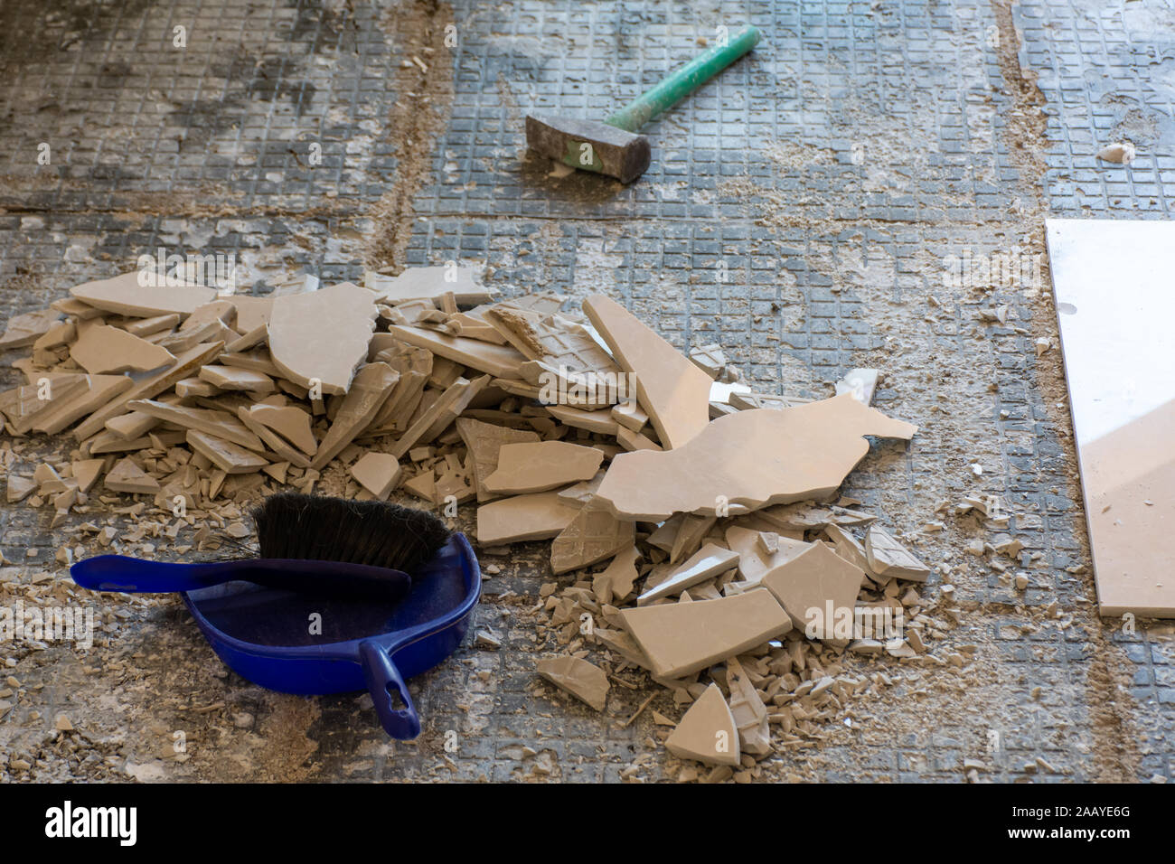 Home renovation close up of broken ceramic tiles in an entrance way
