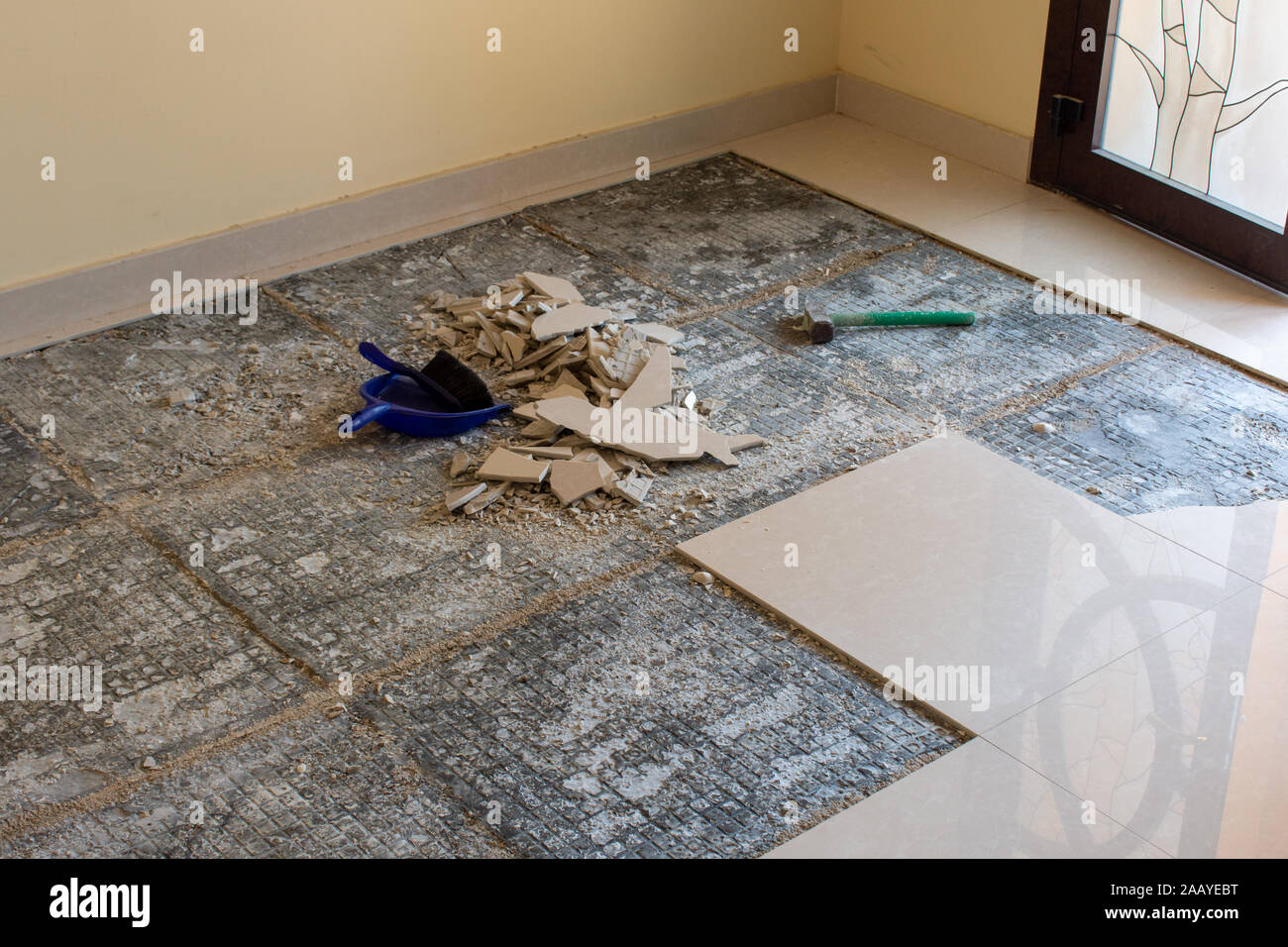 Home Renovation Of Ceramic Tiles In An Entrance Way Breaking Up
