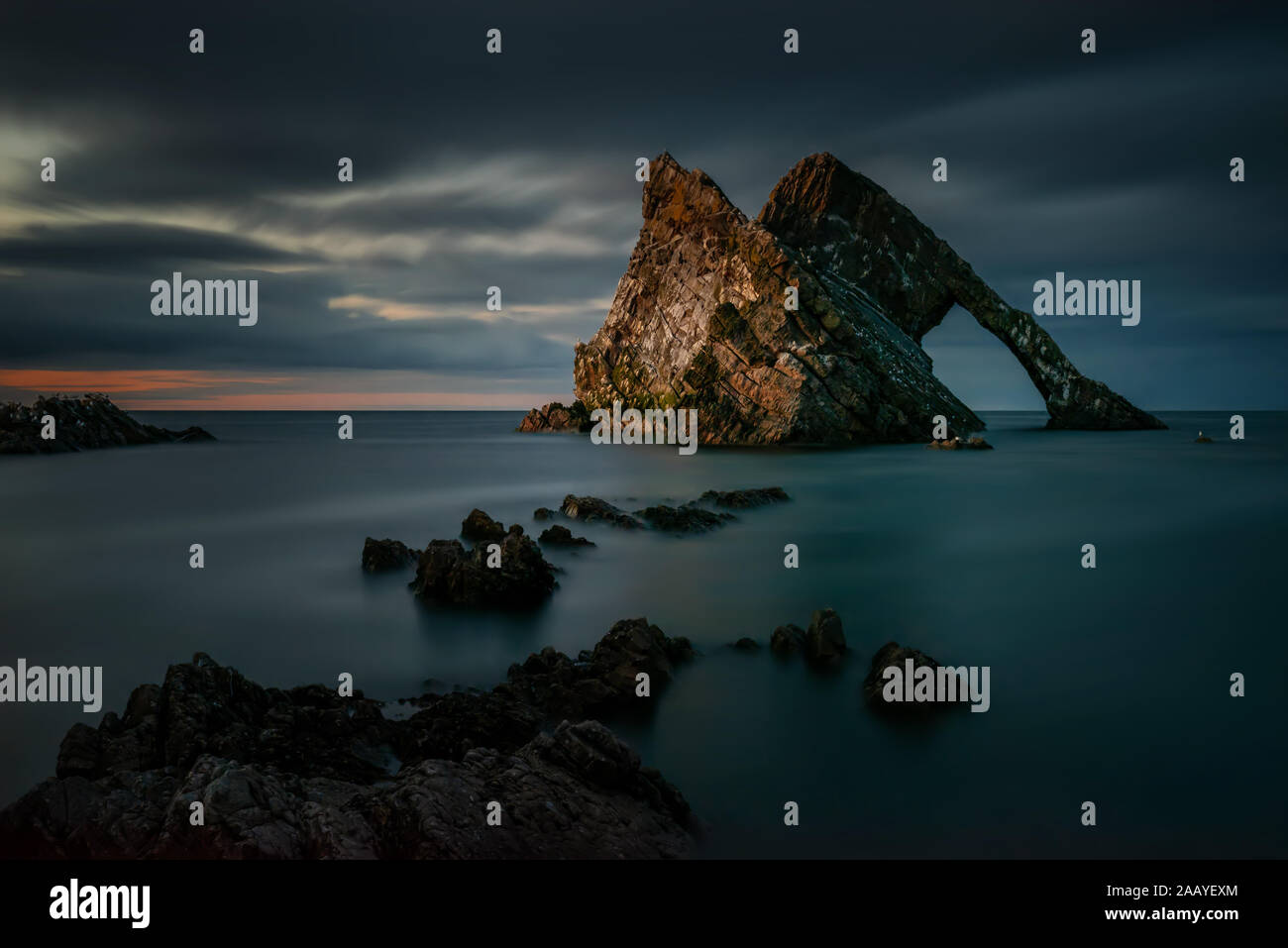 Bow Fiddle Rock formations in dusk, Portknockie, Scotland Stock Photo