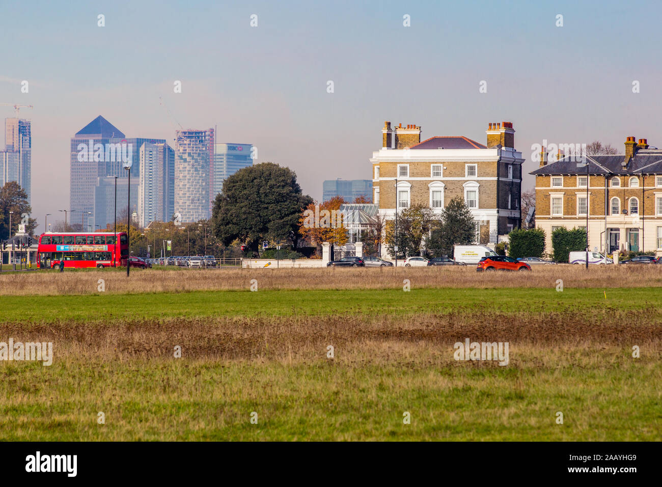 Town houses seen across Blackheath with Dockland skyscrapers in the