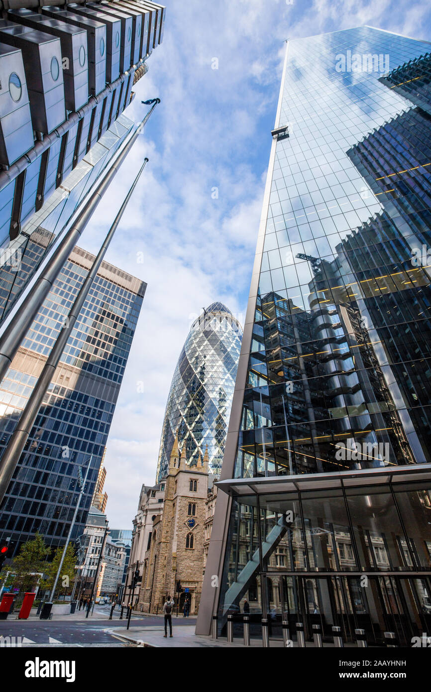 30 St Mary Axe, the Gherkin tower in London seen between the Lloyds building and the Scalpel, England Stock Photo