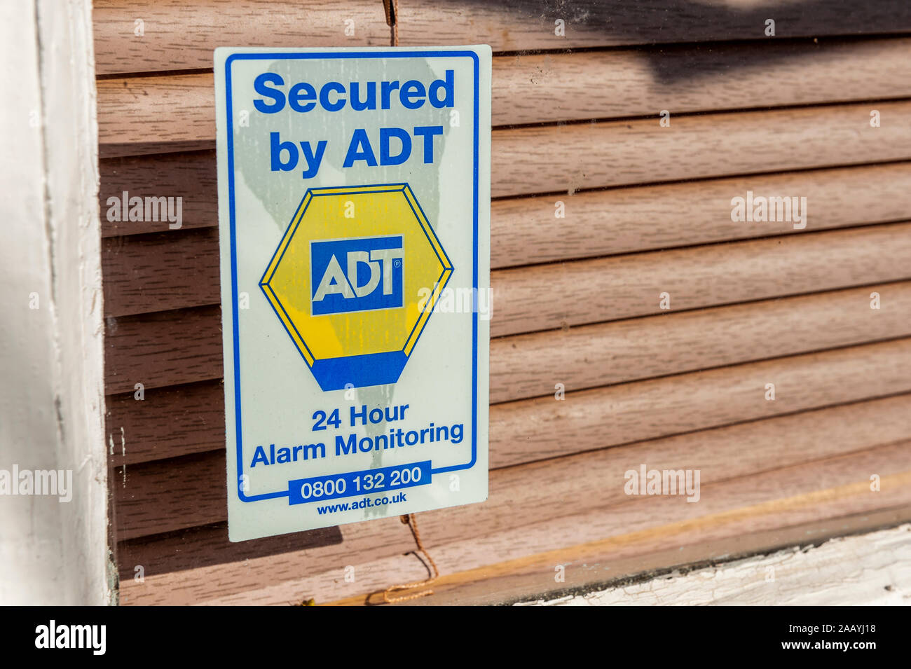 Secured by ADT window sticker, security, 24 hour Alarm Monitoring. Stock Photo