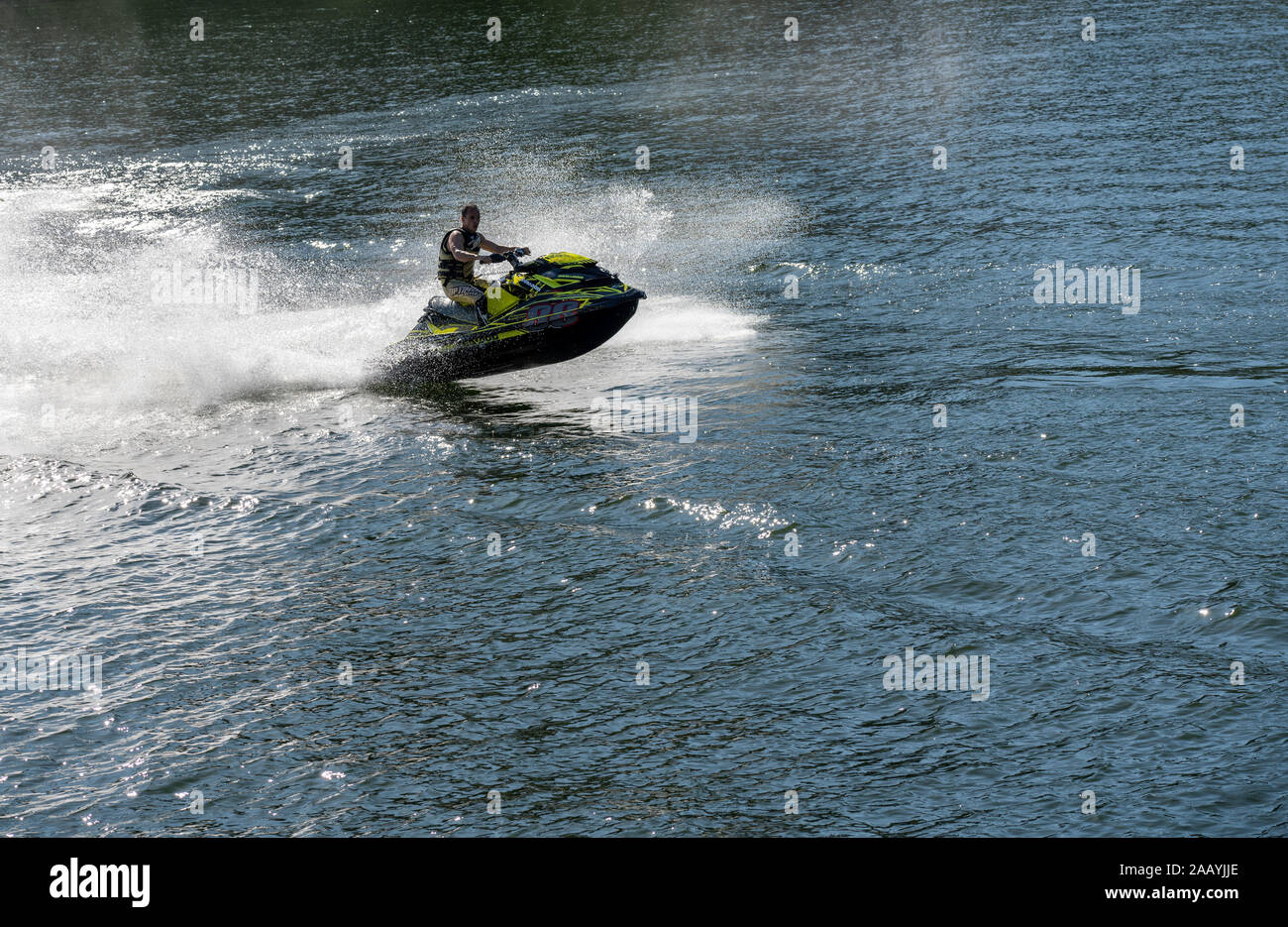 Praia Fluvial Bitetos, Portugal - 17 August 2019: Sea Doo watercraft rider in the river by the Bitetos beach in Douro valley Stock Photo