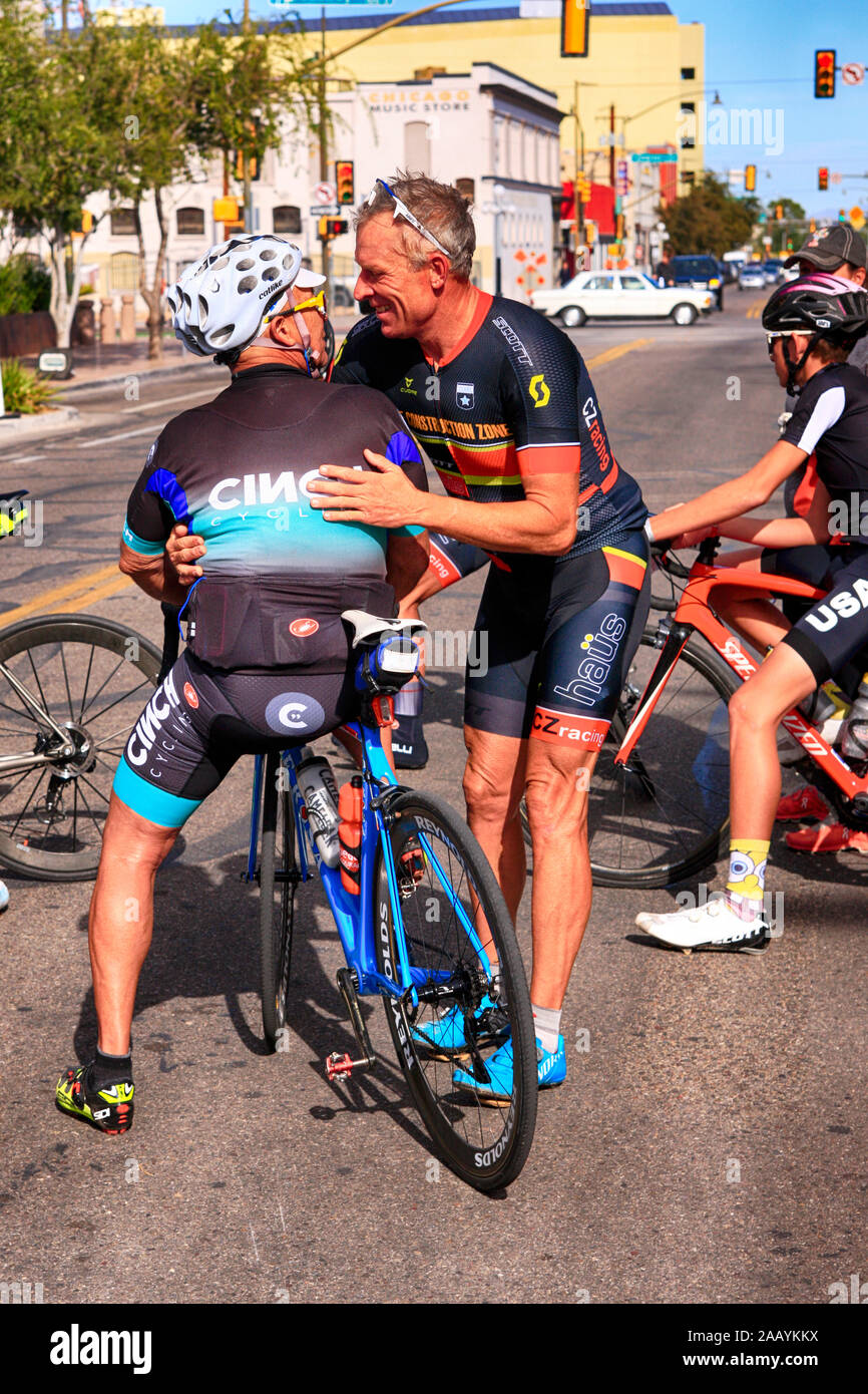 Two competitors and friends give each other a hug at the 100mile El Tour de Tucson bicycle race Stock Photo
