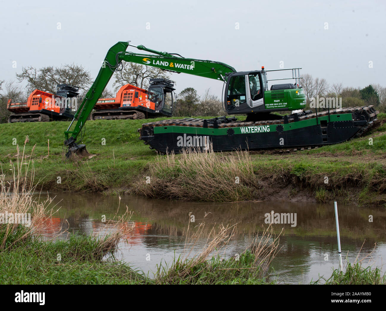 Dredging begins on the local river to prevent further flooding at Moreland in Somerset. Homes in the area were recently devastated by severe flooding. March 2014. Stock Photo