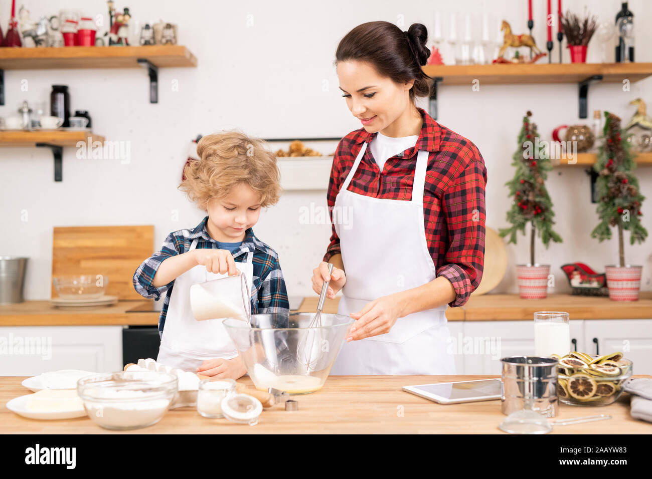 https://c8.alamy.com/comp/2AAYW83/cute-little-boy-adding-sugar-into-shaked-raw-eggs-in-bowl-while-helping-his-mother-with-dough-for-homemade-pastry-in-the-kitchen-2AAYW83.jpg