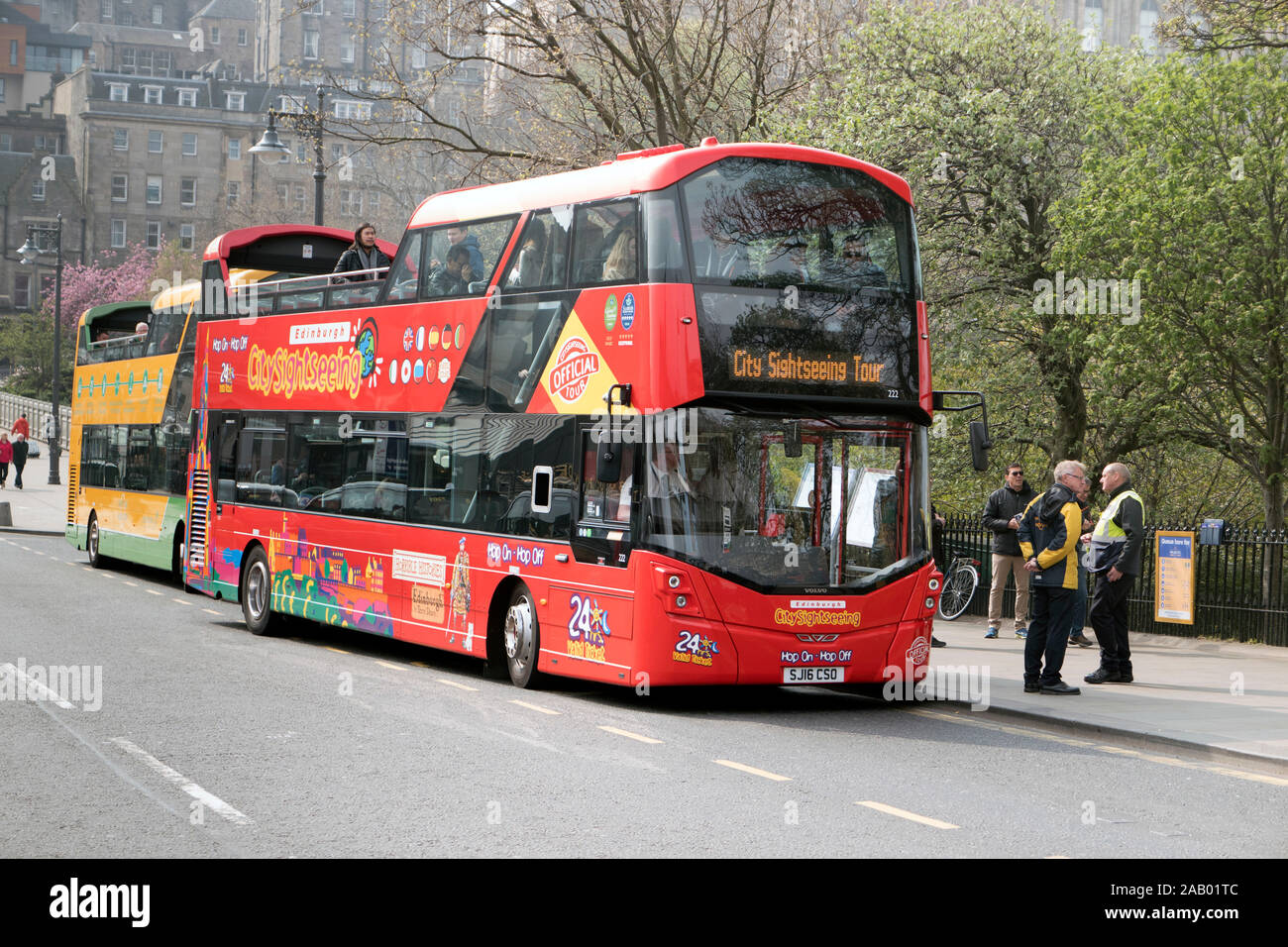 Open top red double-decker bus offers city sightseeing tours Edinburgh Scotland Stock Photo