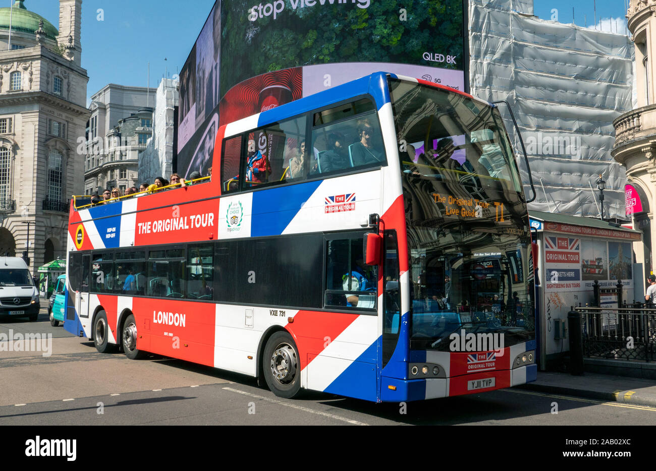Open top Union Jack flag tour bus Piccadilly London England Stock Photo