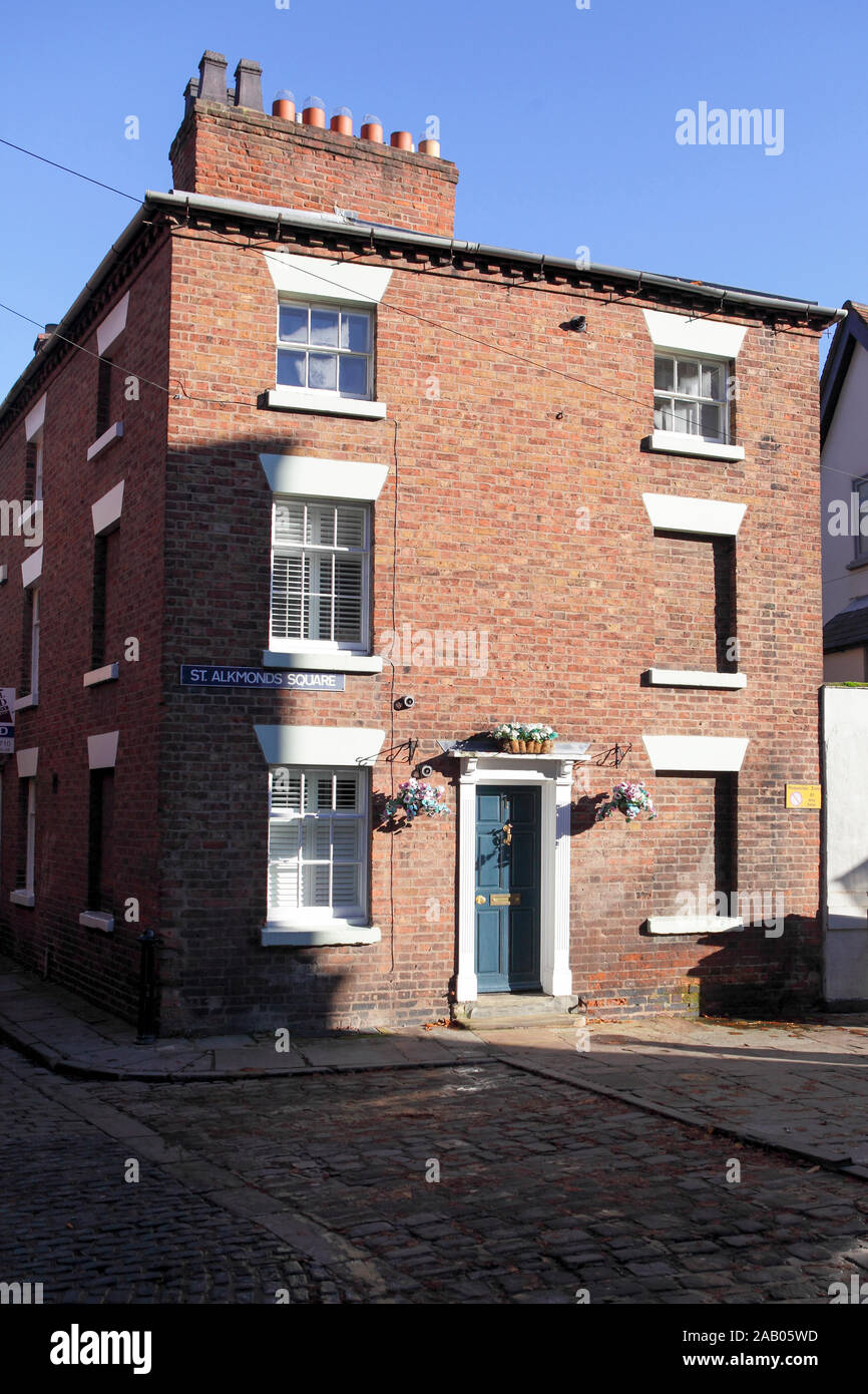 Three storey Georgian House situated opposite St Alkmund's Church in the Shropshire, viewed here in light and shadow. Stock Photo