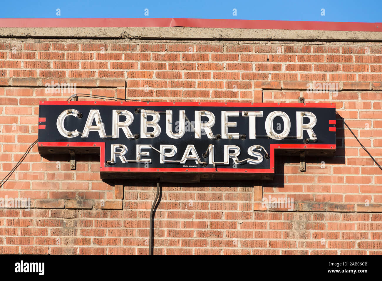Carburetor repair sign on a shop in downtown Baker City, Oregon. Stock Photo