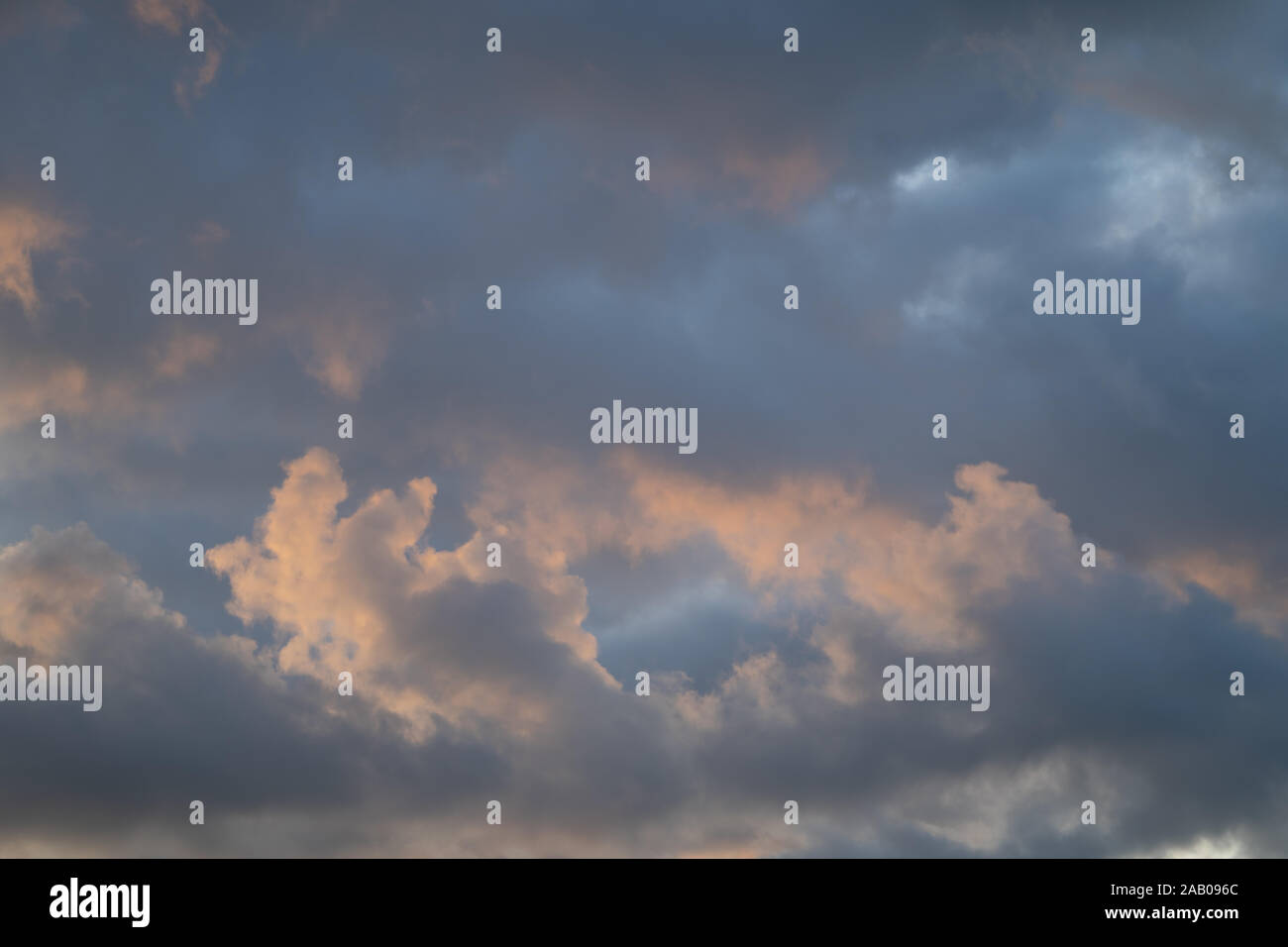 Mackerel sky. Blue sky with light broken cloud with the sun giving a