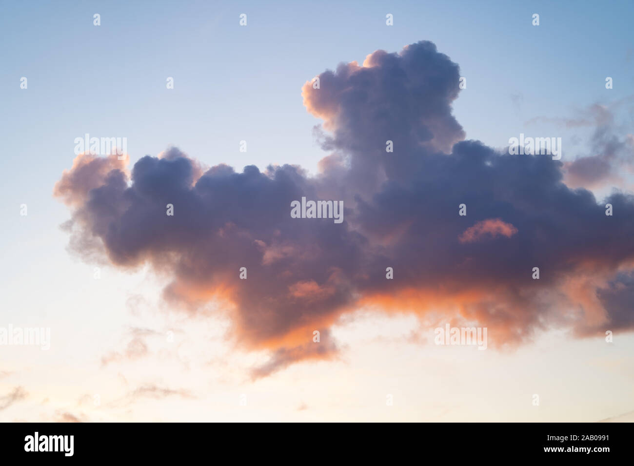 Mackerel sky. Blue sky with light broken cloud with the sun giving a