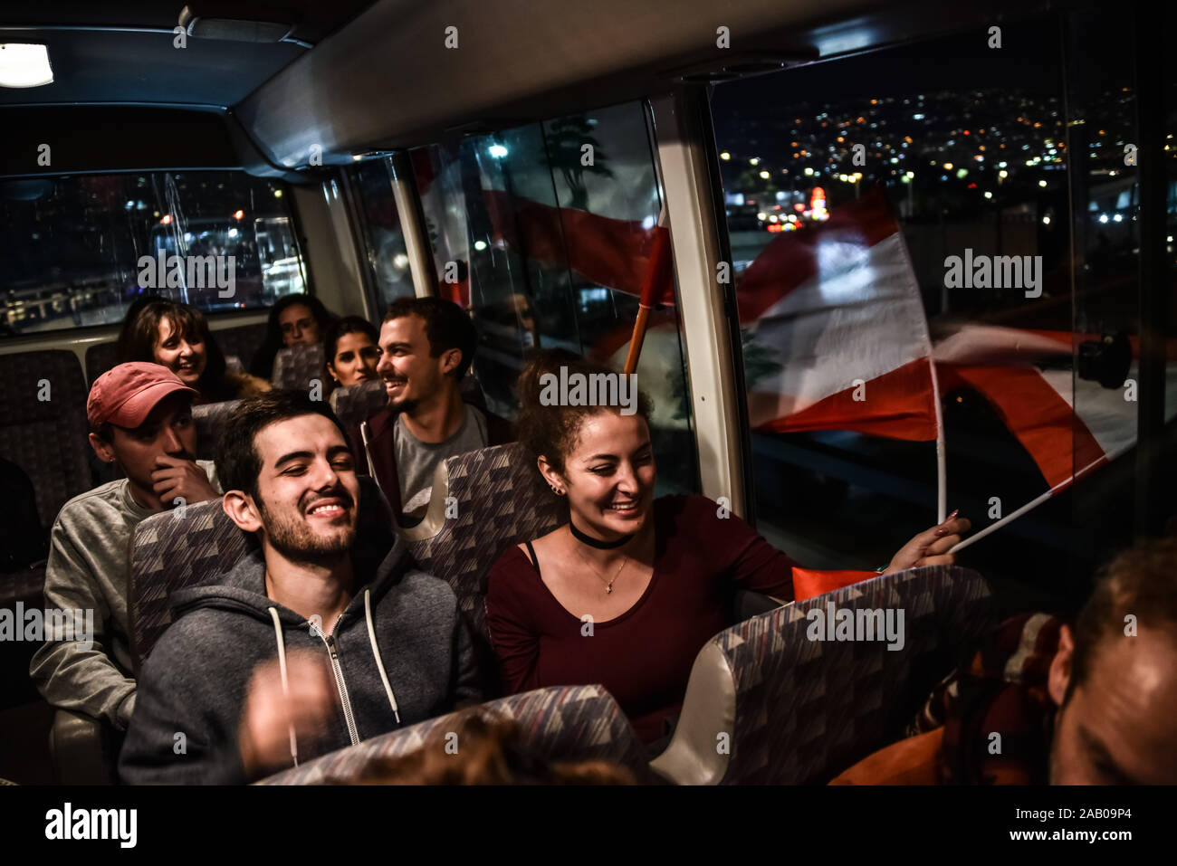 Rafik Hariri Airport arrivals on Day 37 of country-wide protests in Lebanon. Lebanese expats traveled from France and the UAE to Beirut, on Lebanese Independence Day, in solidarity with their home country. They were transferred in a convoy of buses and cars directly to Downtown Beirut where they immediately joined the protest and Independence Day celebrations. Stock Photo