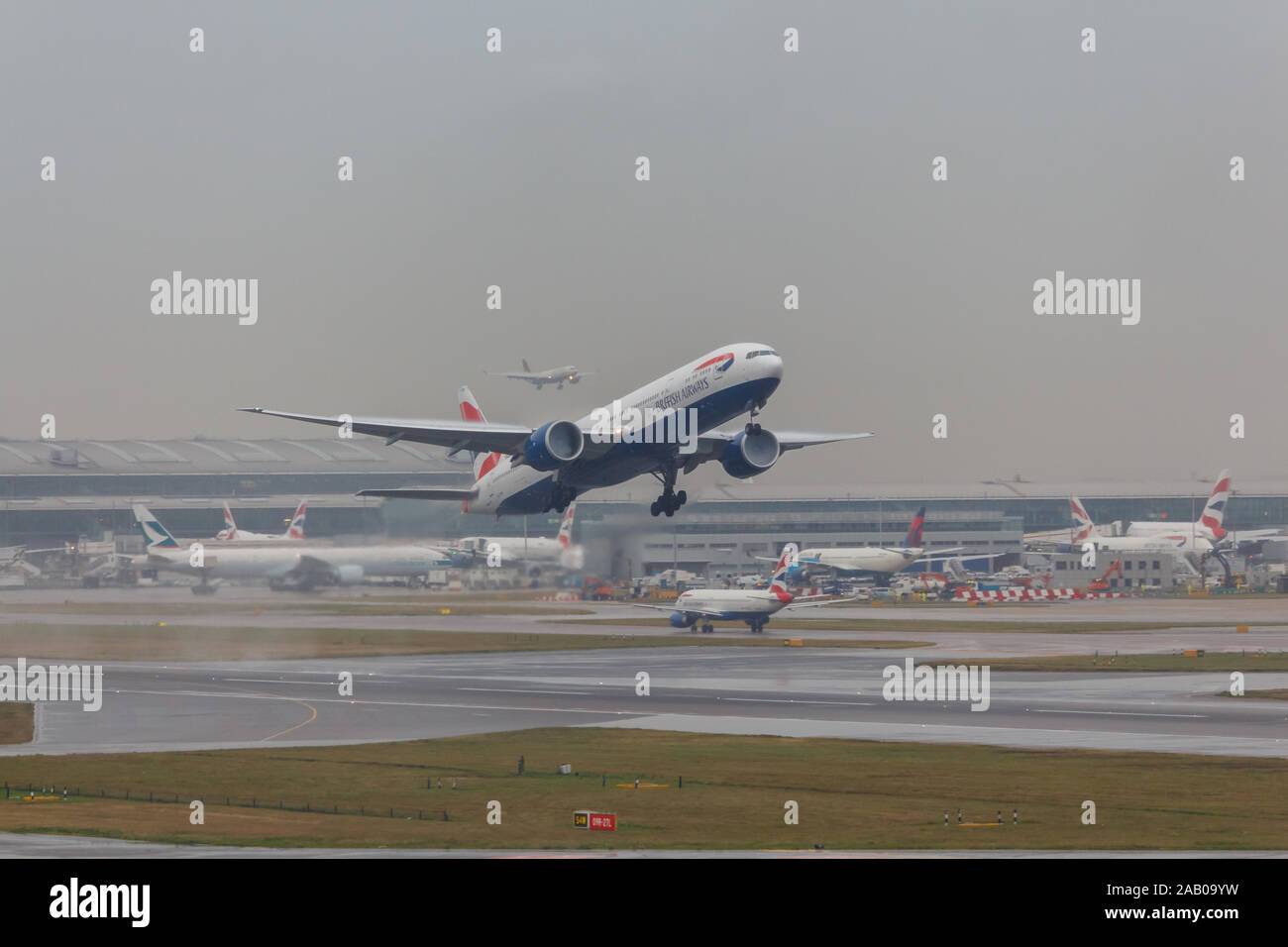 London, England - Circa 2019 : British Airways Boeing 777 GSTBH Taking off from LHR Airport Stock Photo