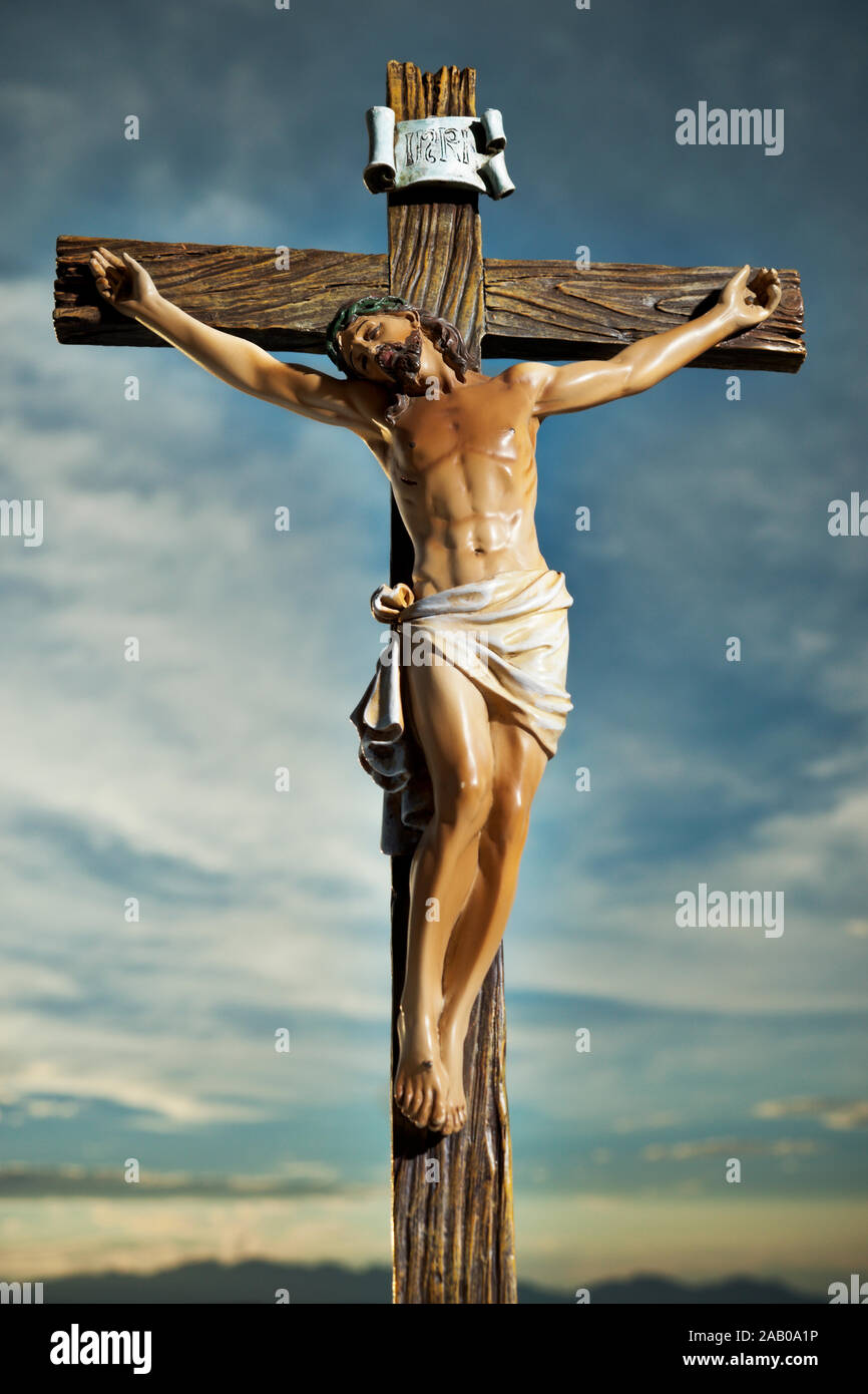 A small statue of Jesus Christ on the Cross Stock Photo