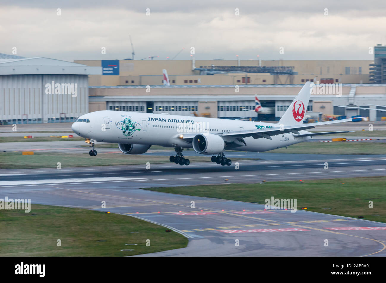 London, England - Circa 2019 : Japan Airlines Boeing 777 Aircraft JA734J Landing at London Heathrow Airport Stock Photo