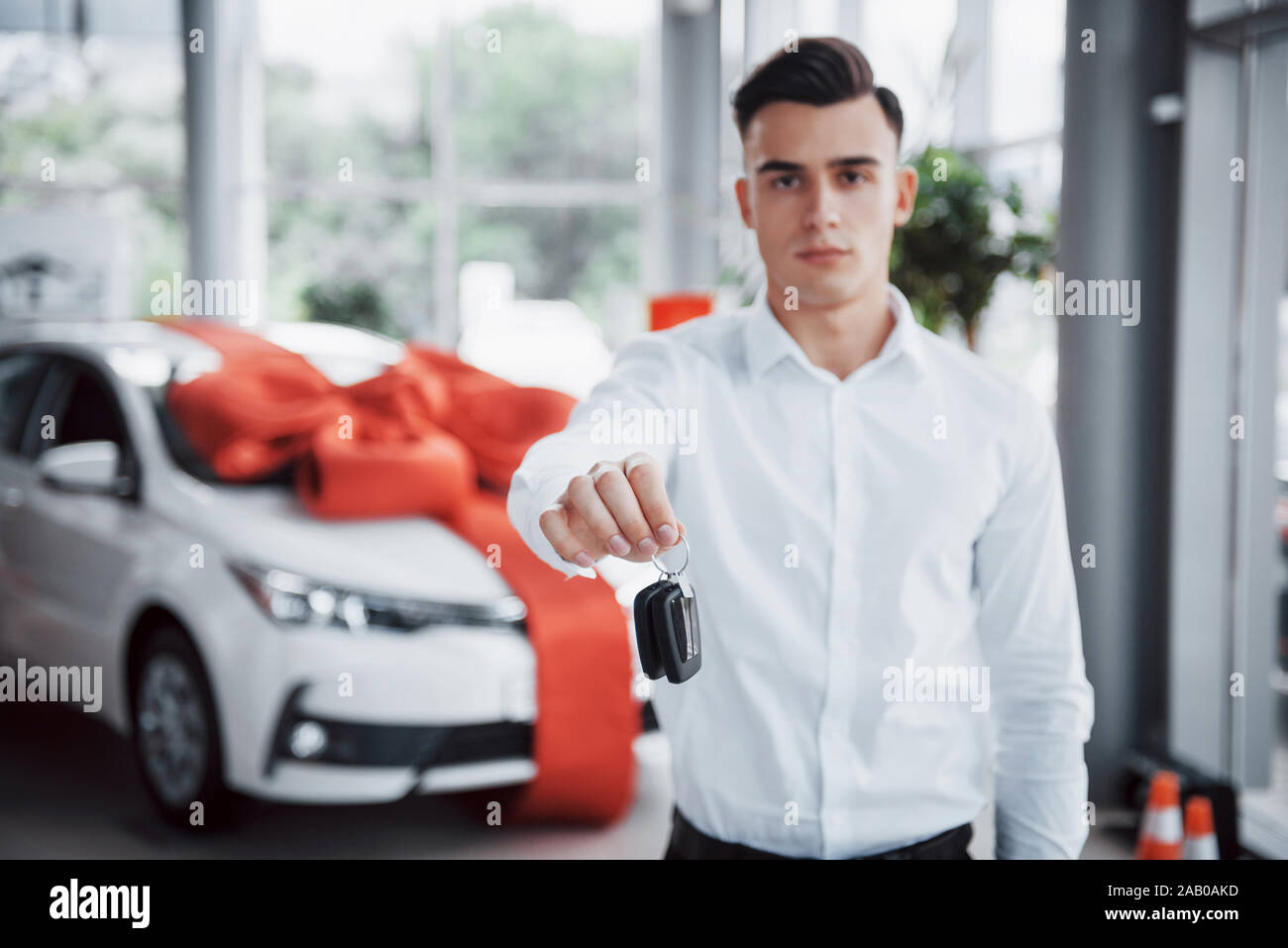 Happy dealer holding car hi-res stock photography and images - Alamy