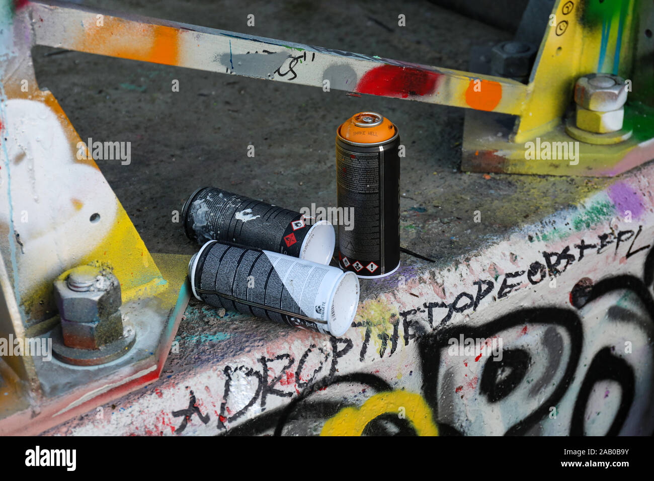 Used cans of spray paint in a bag Stock Photo - Alamy