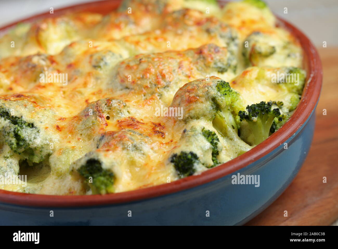 Just baked Broccoli cheese casserole with saffron in a baking dish Stock Photo