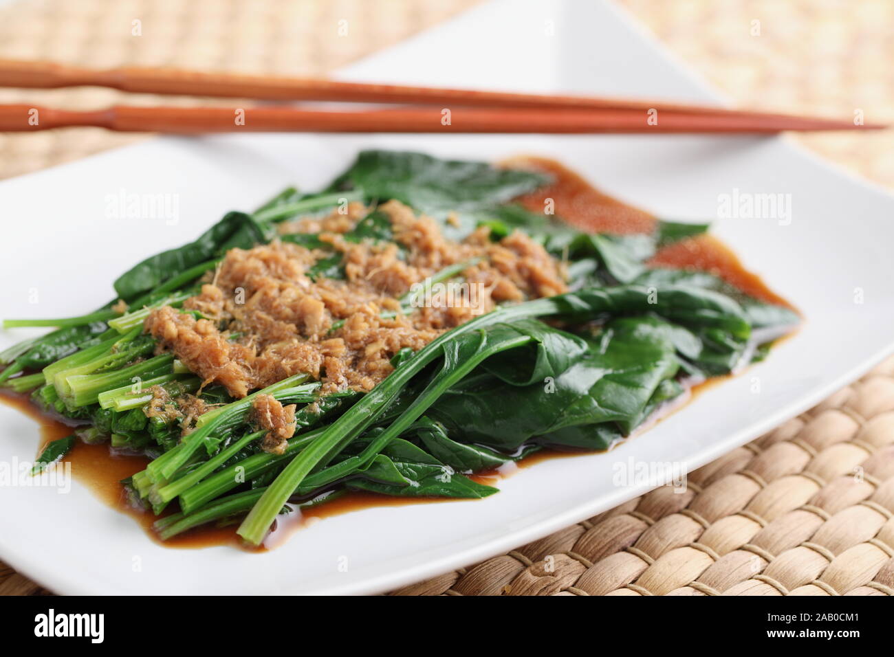 Chinese dish Spinach in ginger sauce for Chinese New Year celebrations Stock Photo