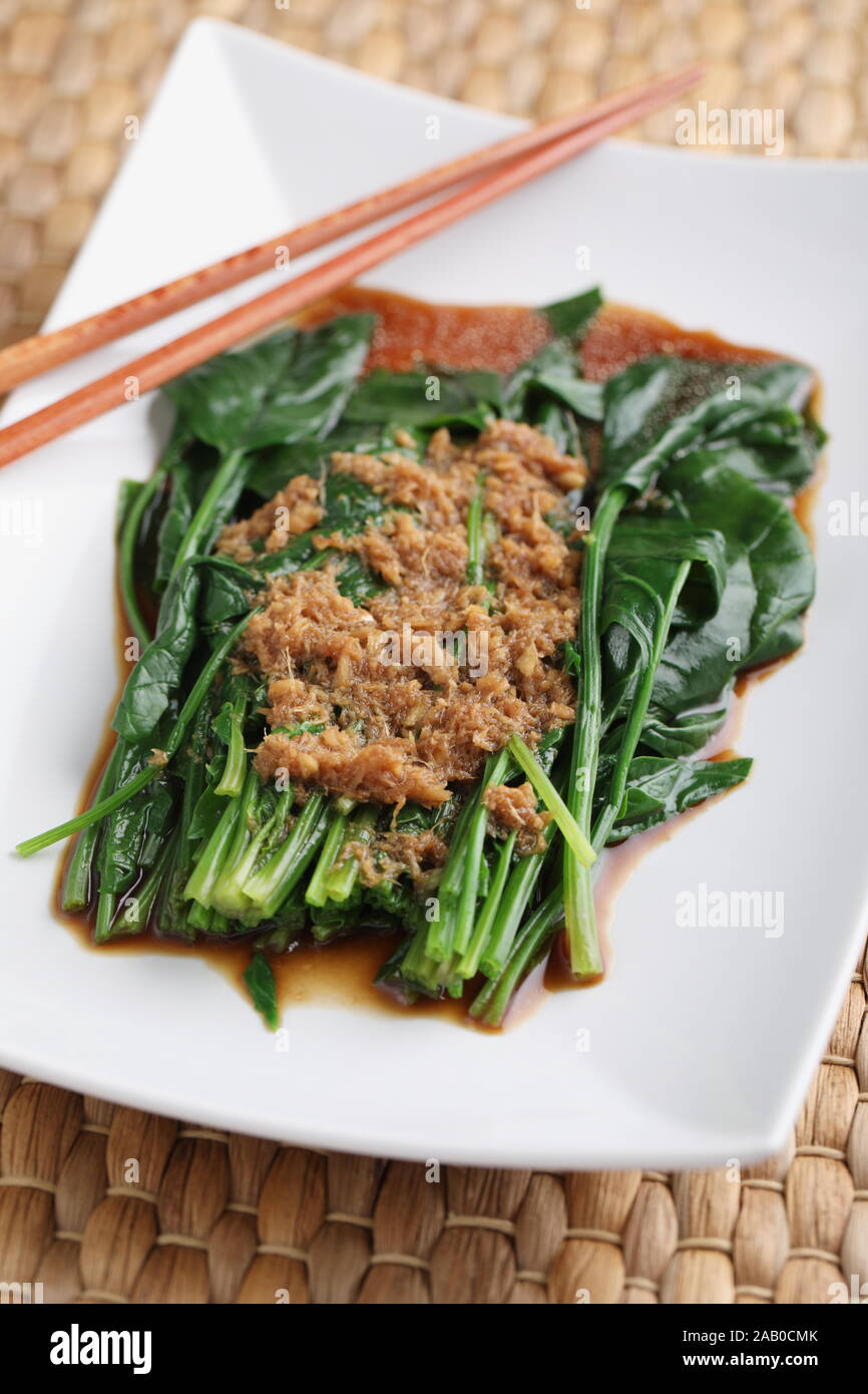Chinese dish Spinach in ginger sauce for Chinese New Year celebrations Stock Photo