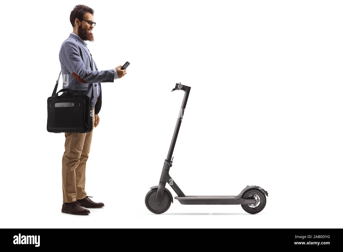 Bearded man with a laptop case renting a scooter with a mobile phone isolated on white background Stock Photo