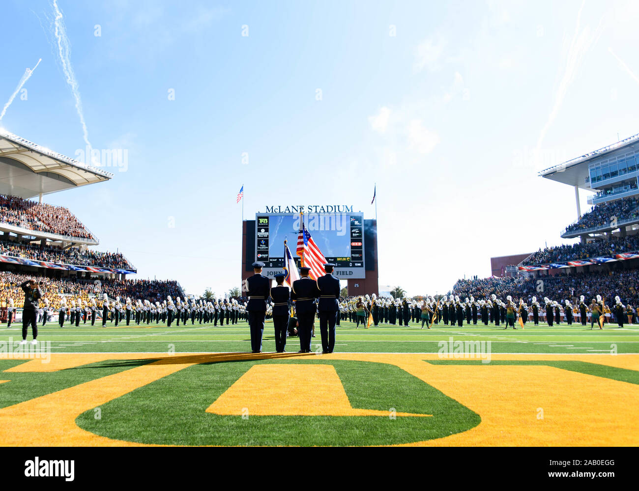 Waco, Texas, USA. 23rd Nov, 2019. ROTC members hold the flags during