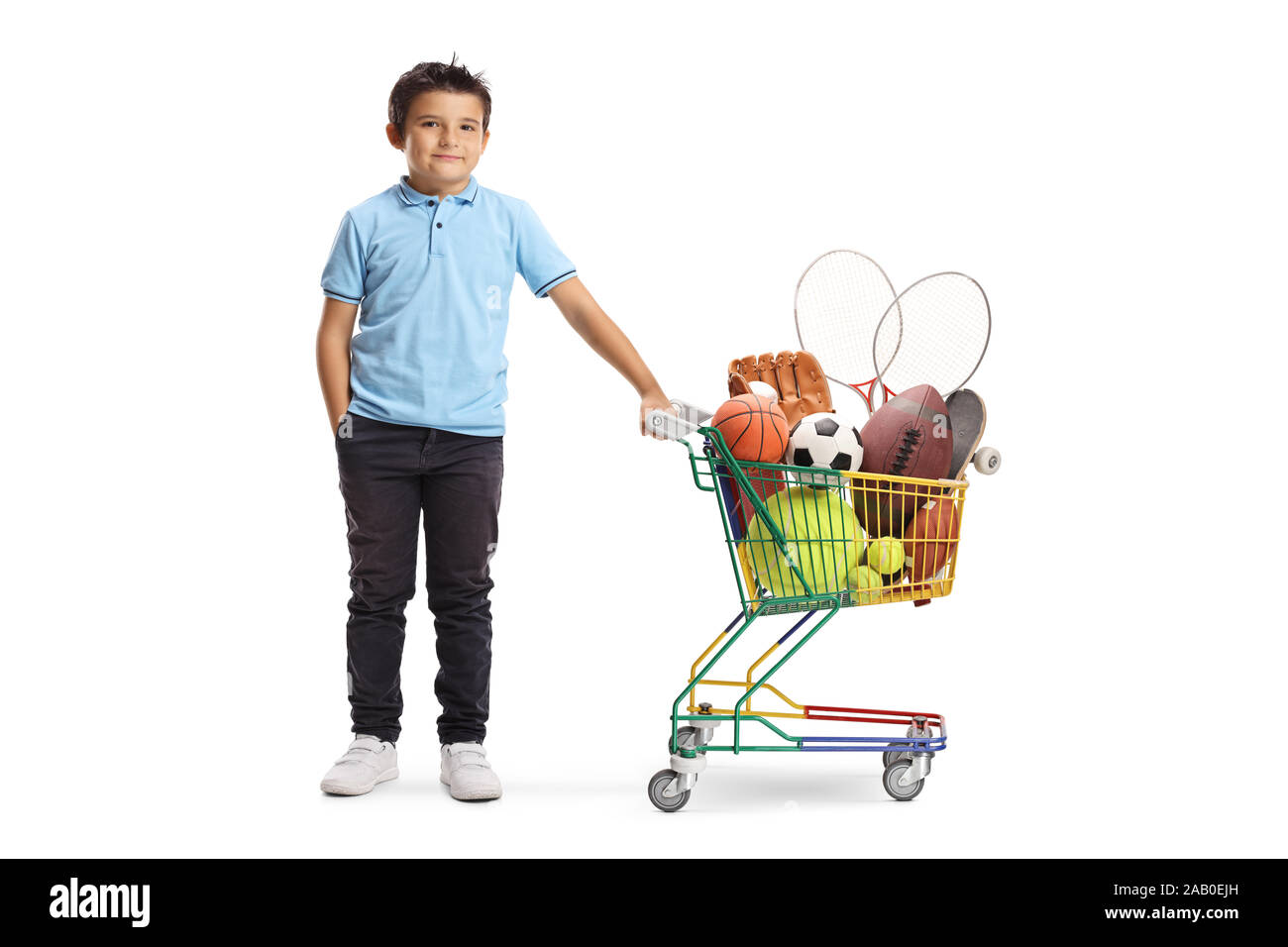 Full length portrait of a boy with a soccer ball, rugby ball, tennis