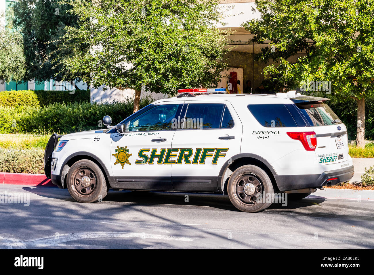 Nov 3, 2019 Cupertino / CA / USA - Santa Clara County Police Sheriff car parked on Apple Infinity Loop Campus, Silicon Valley Stock Photo