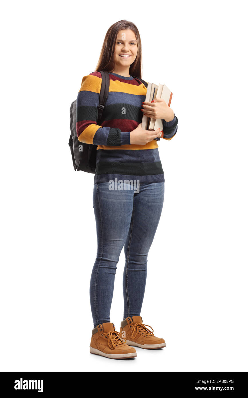 Full length portrait of a happy female student holding books isolated ...