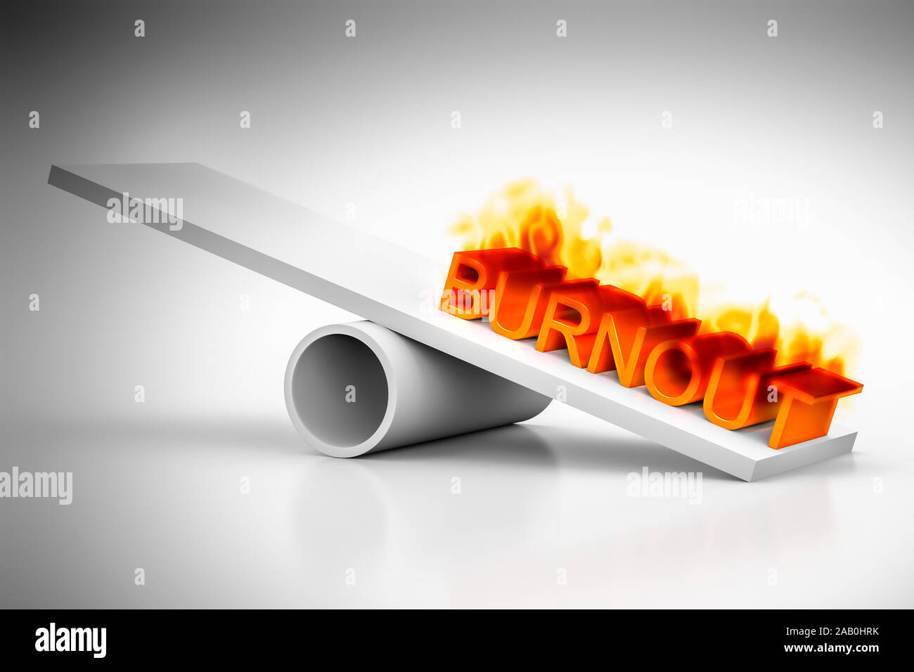 Eine Wippe vor weissem Hintergrund mit dem brennenden Wort "Burnout" Stock Photo