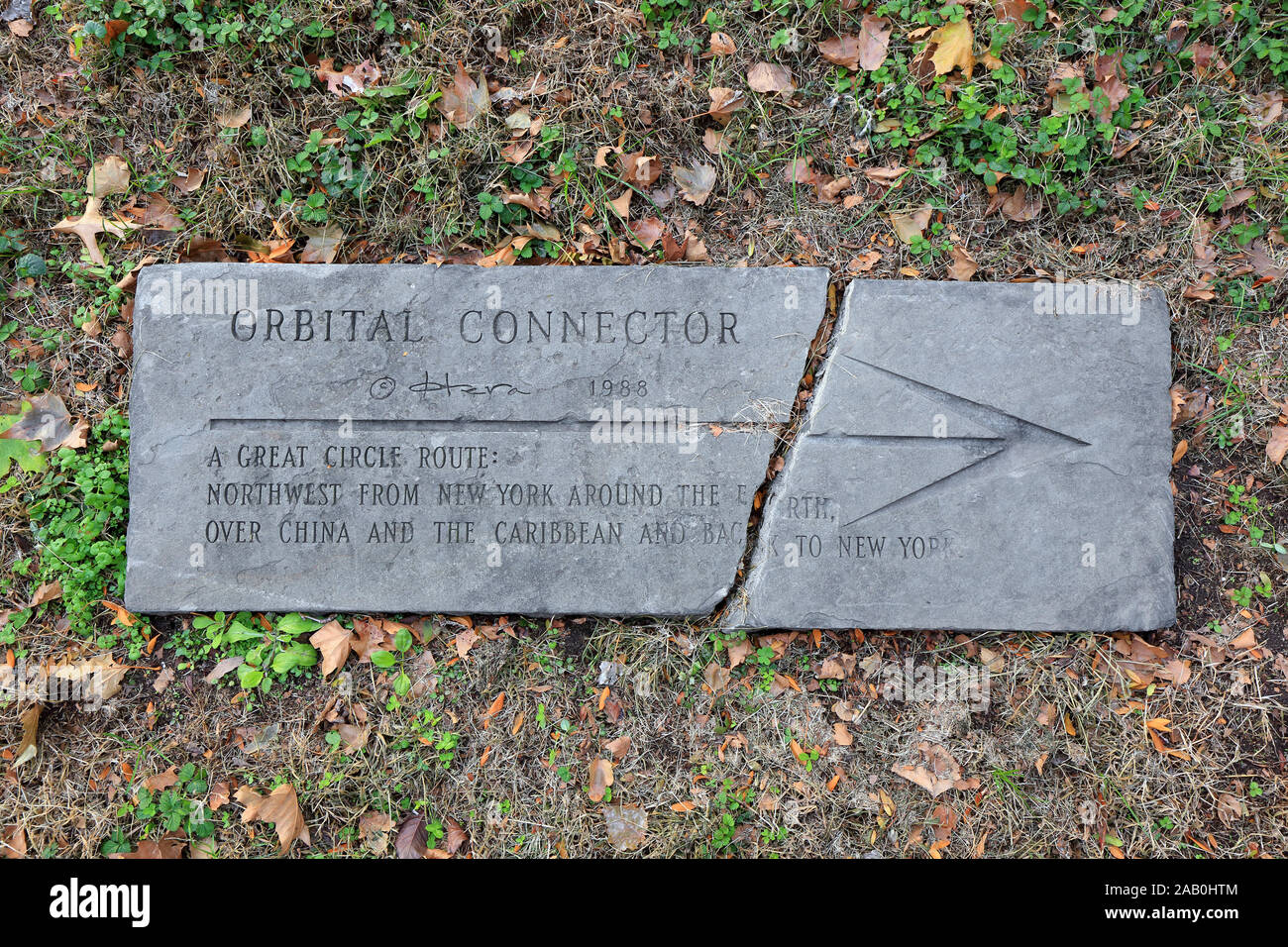 A stone marker describing the Orbital Connector sculpture by Hera Stock Photo
