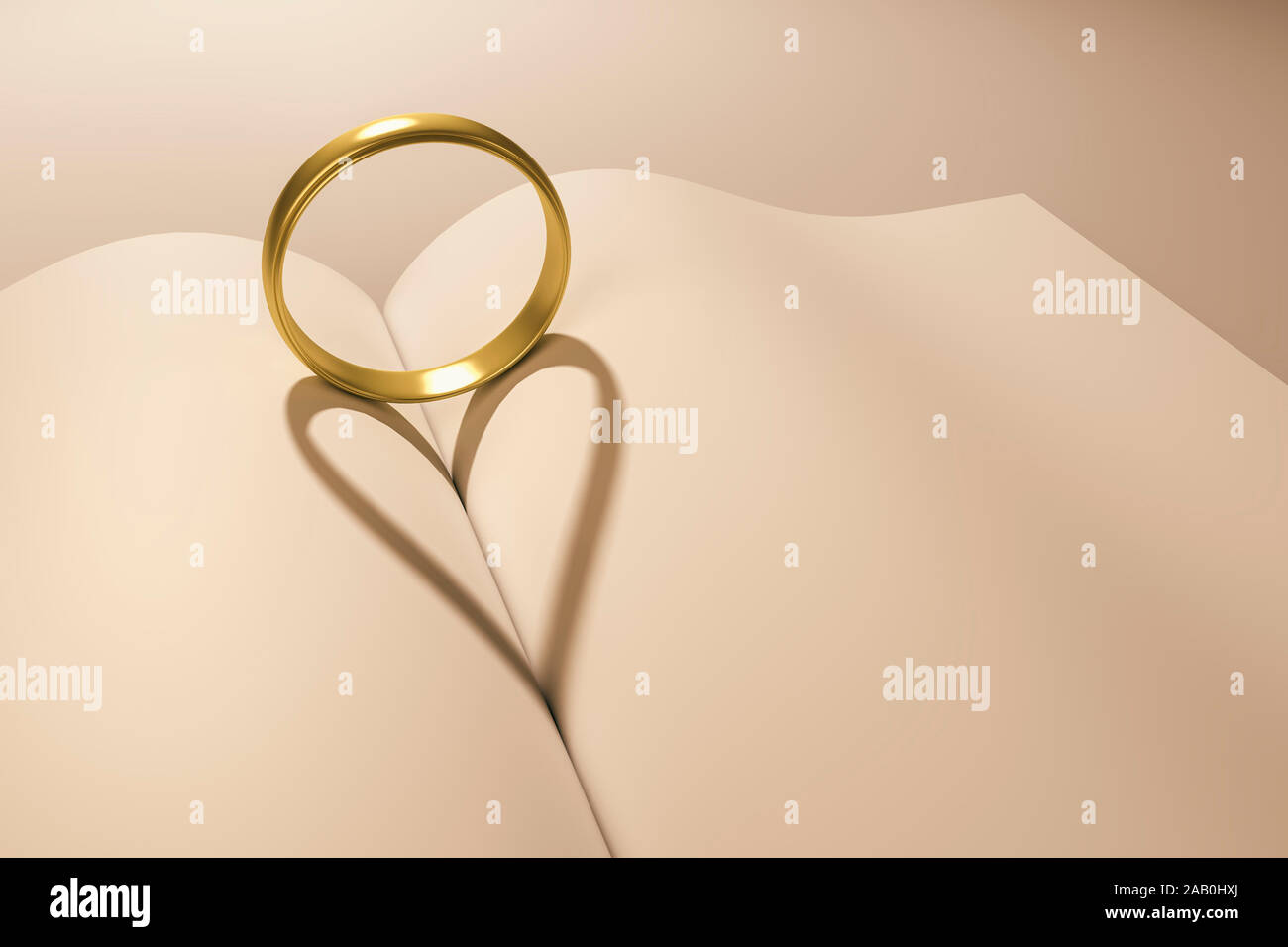 Ein goldener Ring, der einen herzfoermigen Schatten auf ein Buch wirft Stock Photo