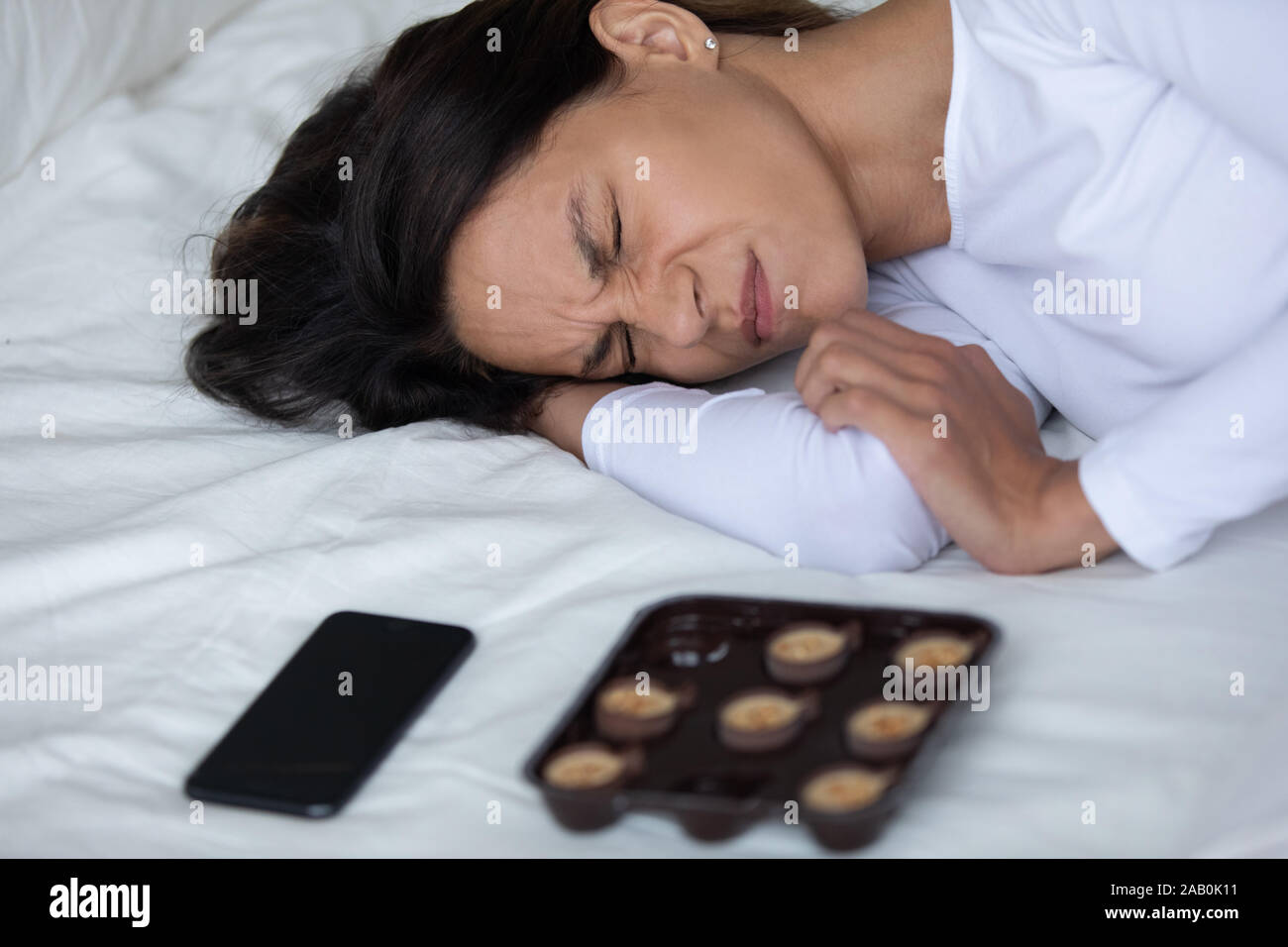Woman crying bed hi-res stock photography and images - Alamy