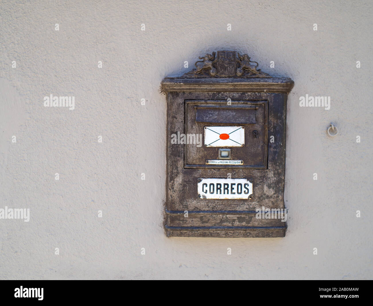 old wooden spanish mailbox on a white wall Stock Photo