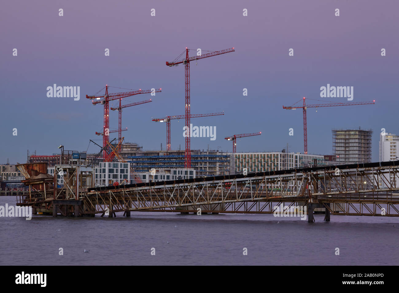 Construction Cranes on the bank of the Thames. Stock Photo