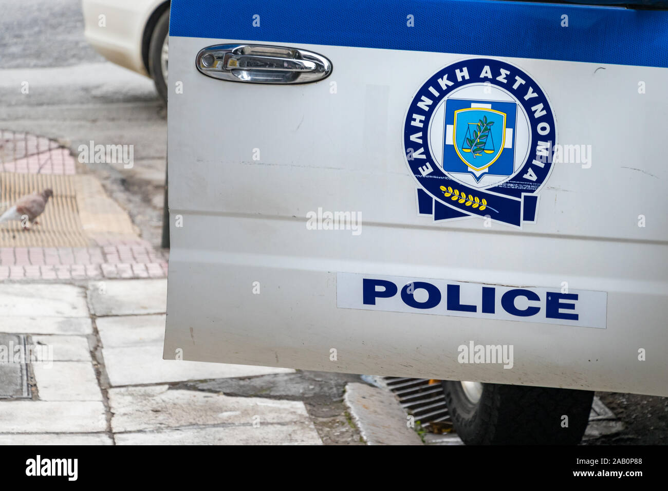 Greek - Astynomia police sign-logo on a the police car door, outside in Athens. Stock Photo