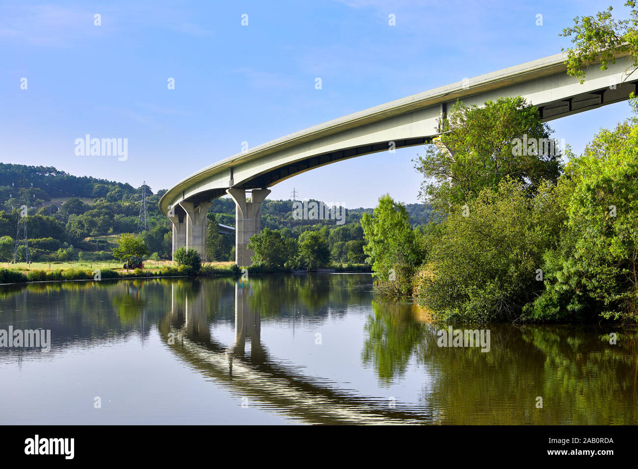 Image of the river vilaine and the D164 bridge on the Northern approach to Redon, Brittany, France Stock Photo
