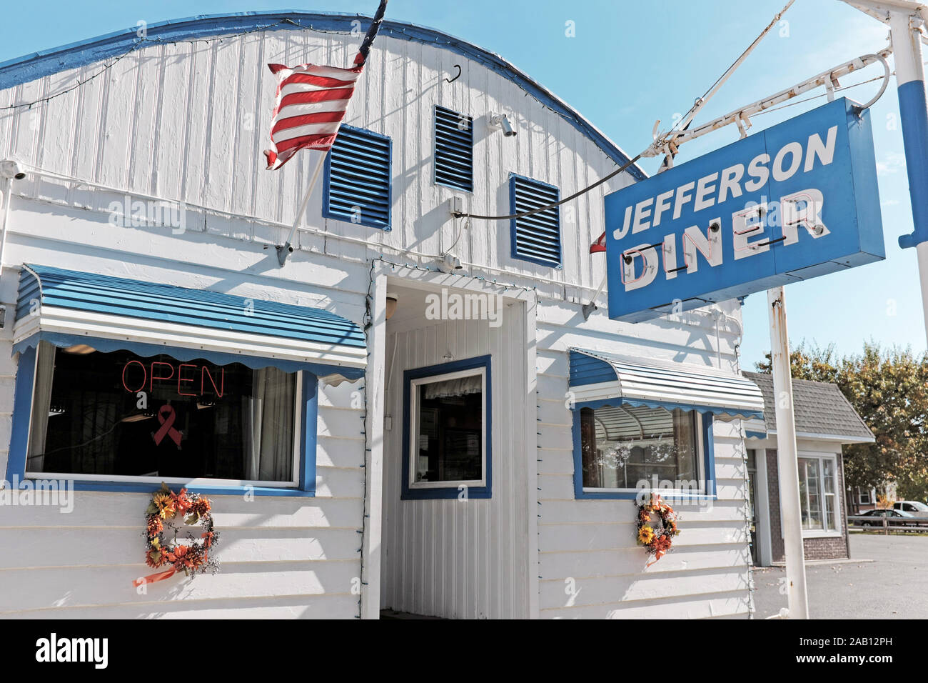 Jefferson Diner on North Chestnut in Jefferson, Ohio is a quintessential small-town 50's-style diner with the exterior evoking simpler times. Stock Photo