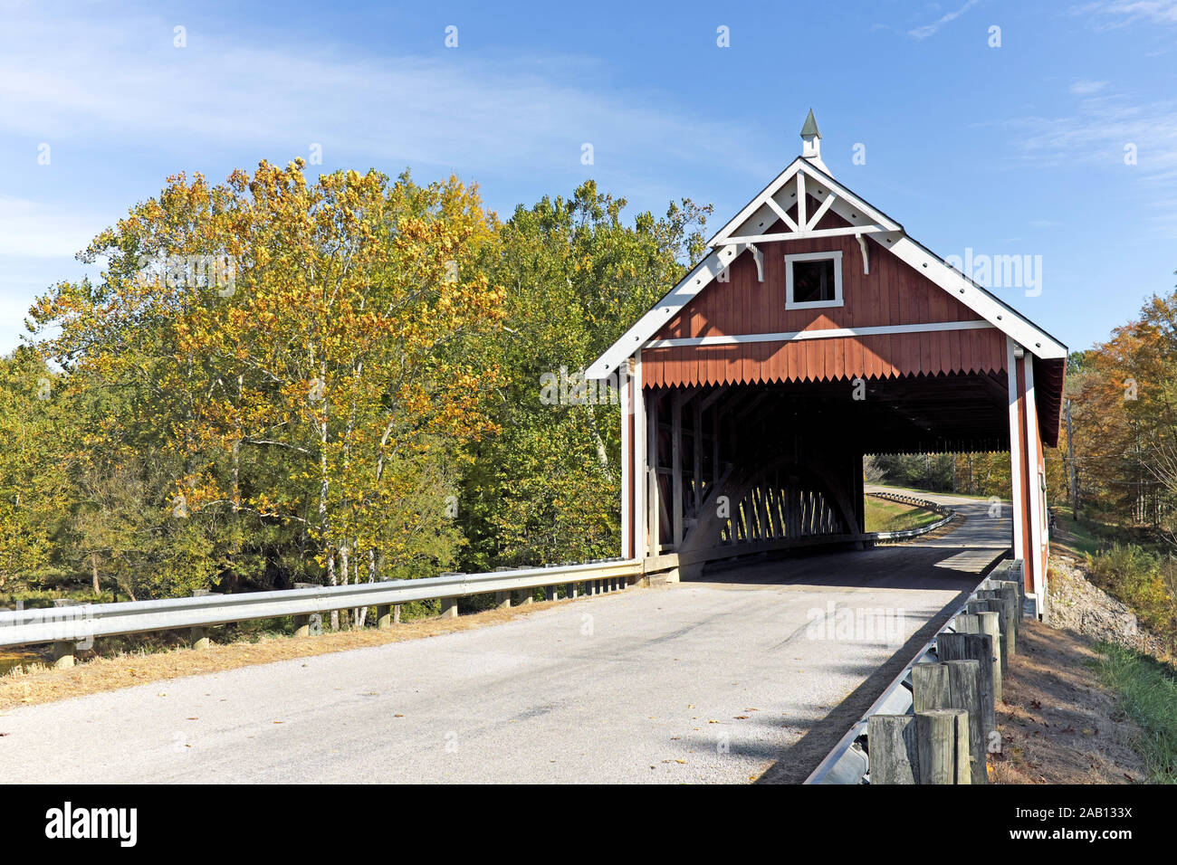 One of 19 covered bridges in Ashtabula County, the Netcher Road wooden covered bridge in Jefferson Township, Ohio, USA is of Neo-Victorian design. Stock Photo