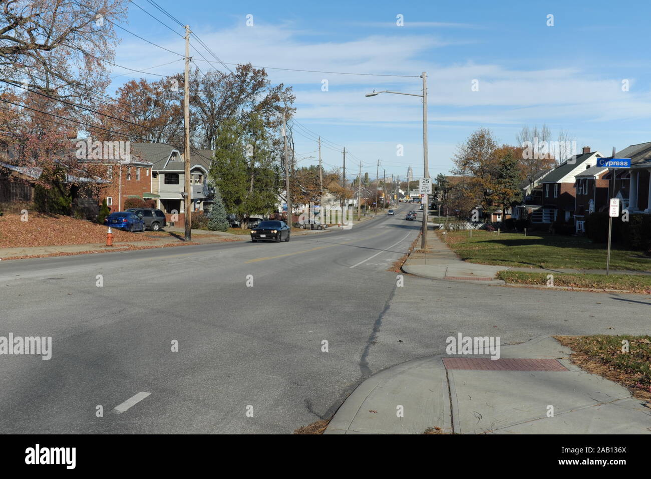 Broadview Road in the middle class neighborhood of Brooklyn Heights, Ohio, USA with the downtown Cleveland skyline in the far distance. Stock Photo