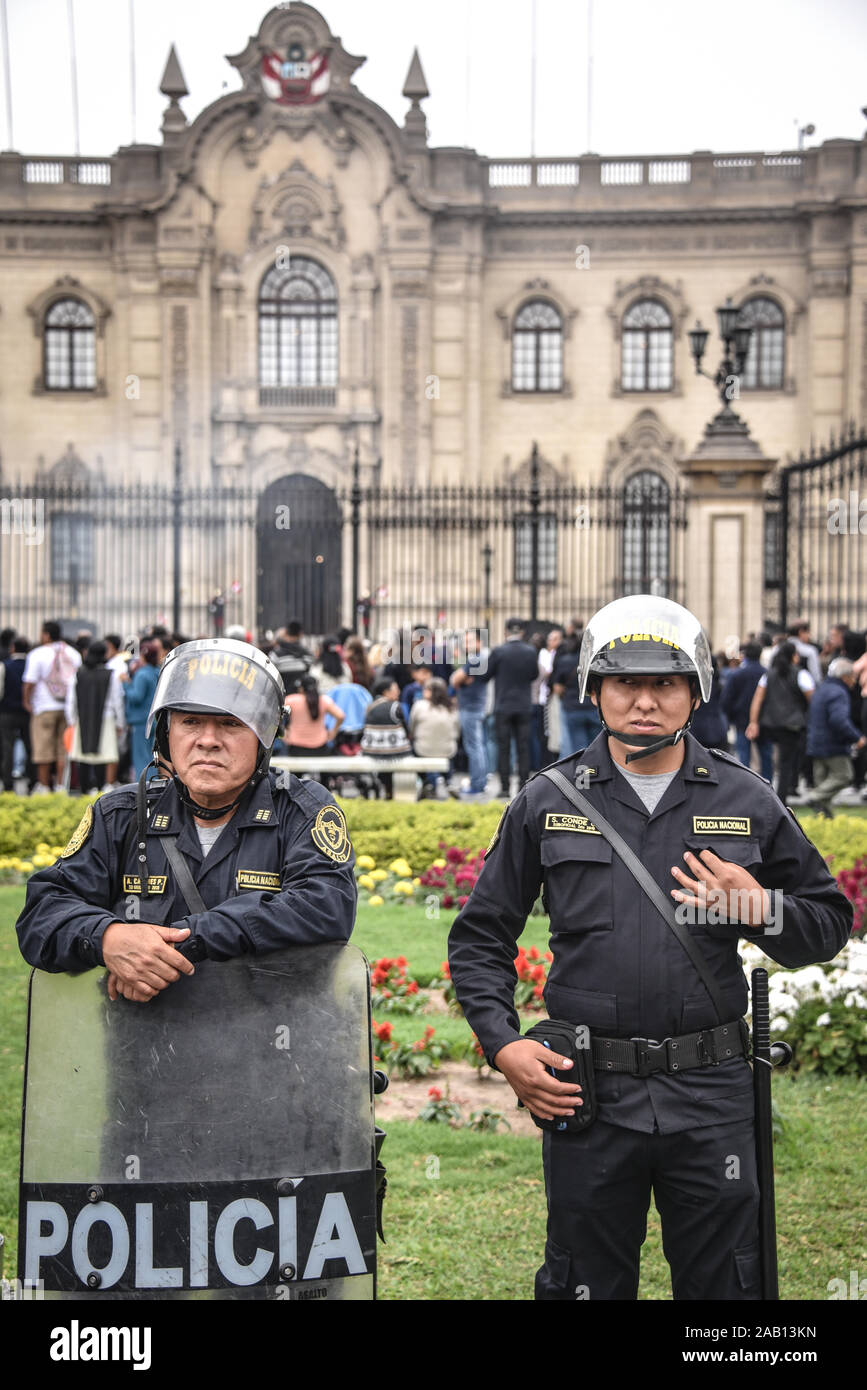 Lima, Peru - Nov 19, 2019: Police officers watch over a procession in Lima's Plaza de Armas Stock Photo