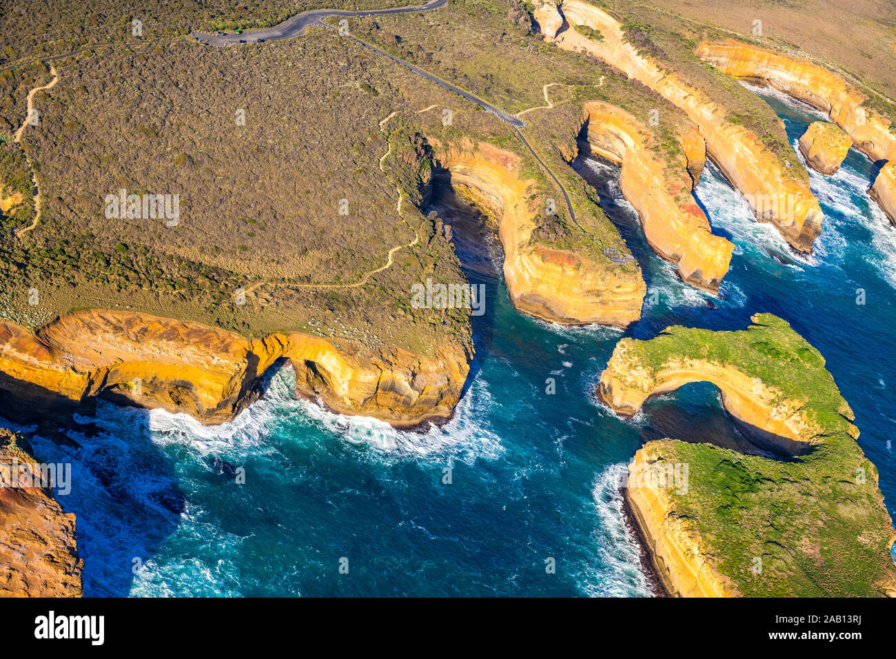 Aerial view of the Great Ocean Road and Muttonbird Island within Port Campbell National Park, Victoria, Asutralia Stock Photo