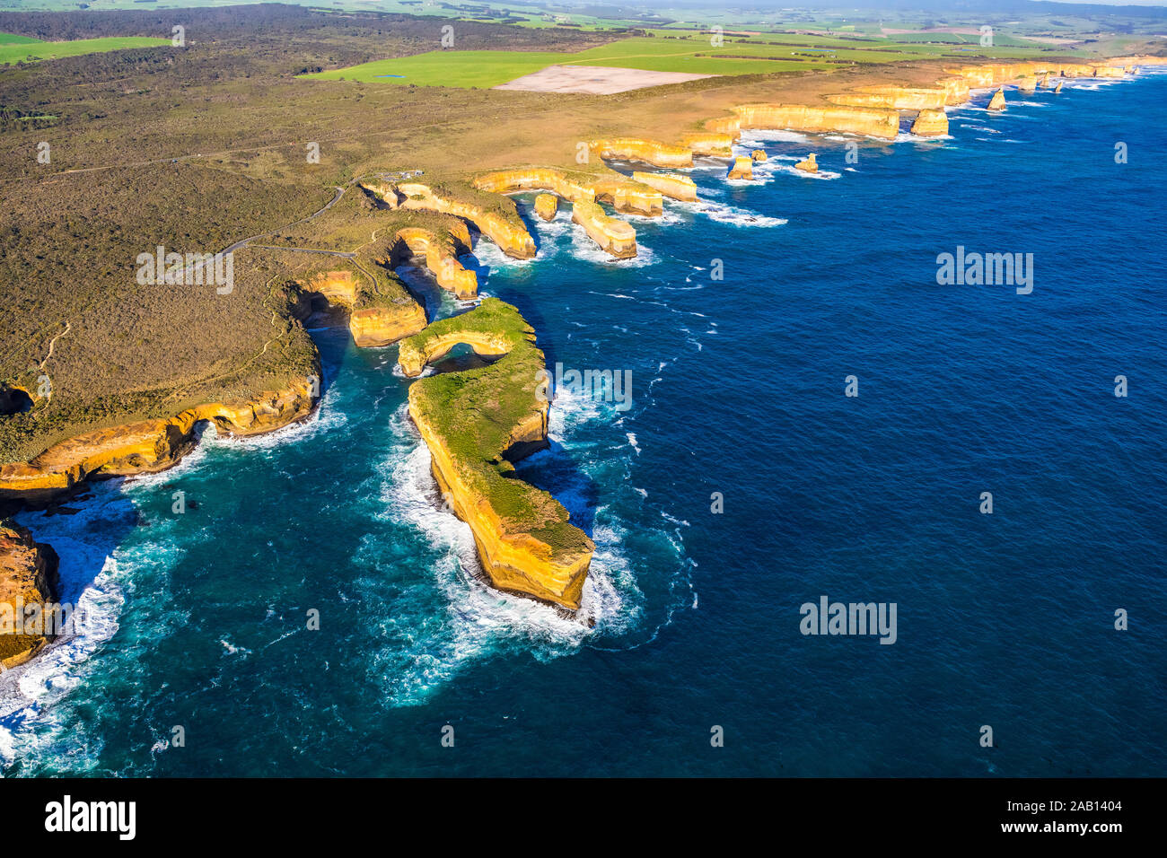 Aerial view of the Great Ocean Road and Muttonbird Island within Port