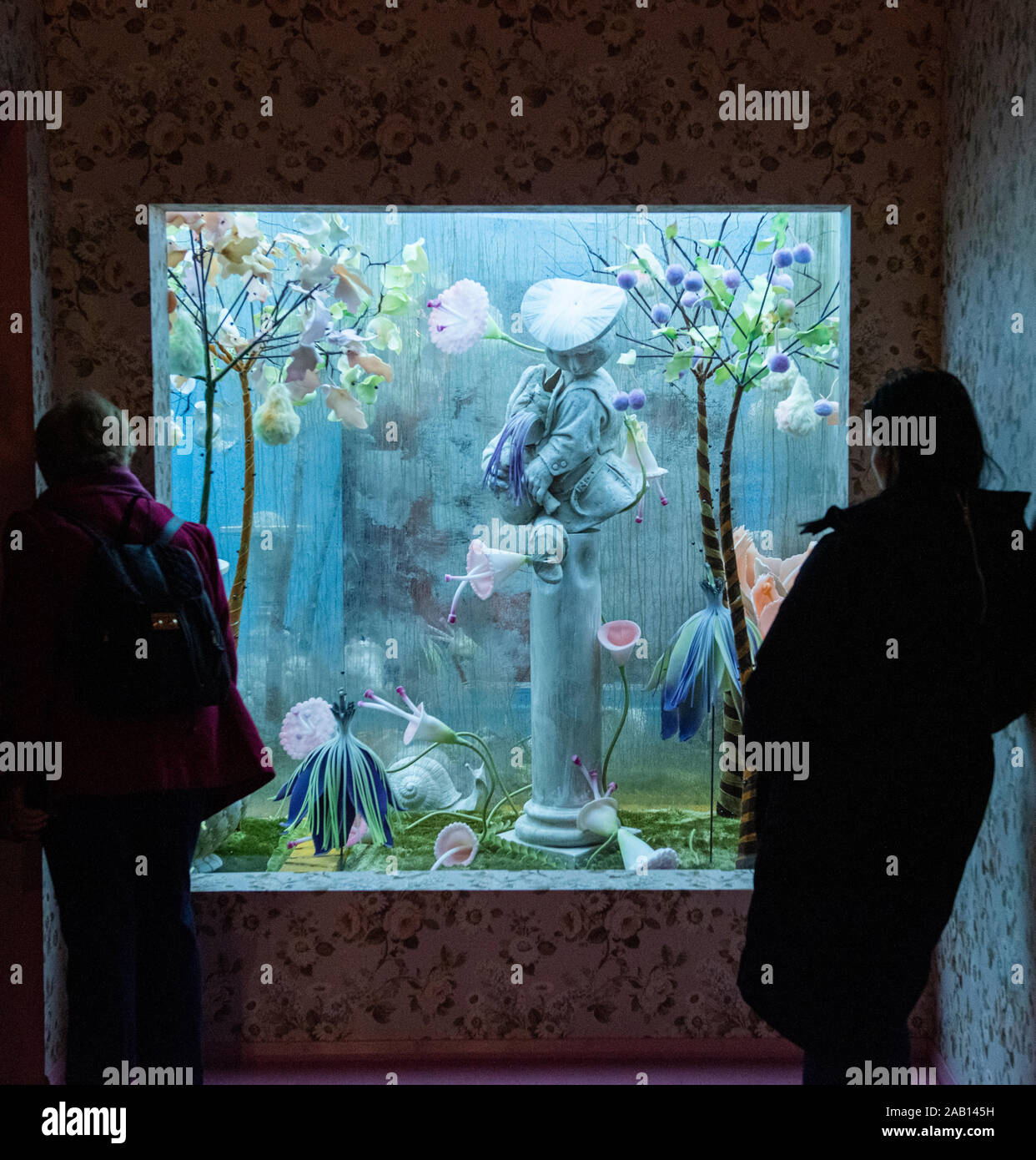 Visitors looking at exhibit in the Tim Walker 'Wonderful Things' exhibition at the V&A Museum, Nov 2019. South Kensington, London, England, UK. Stock Photo