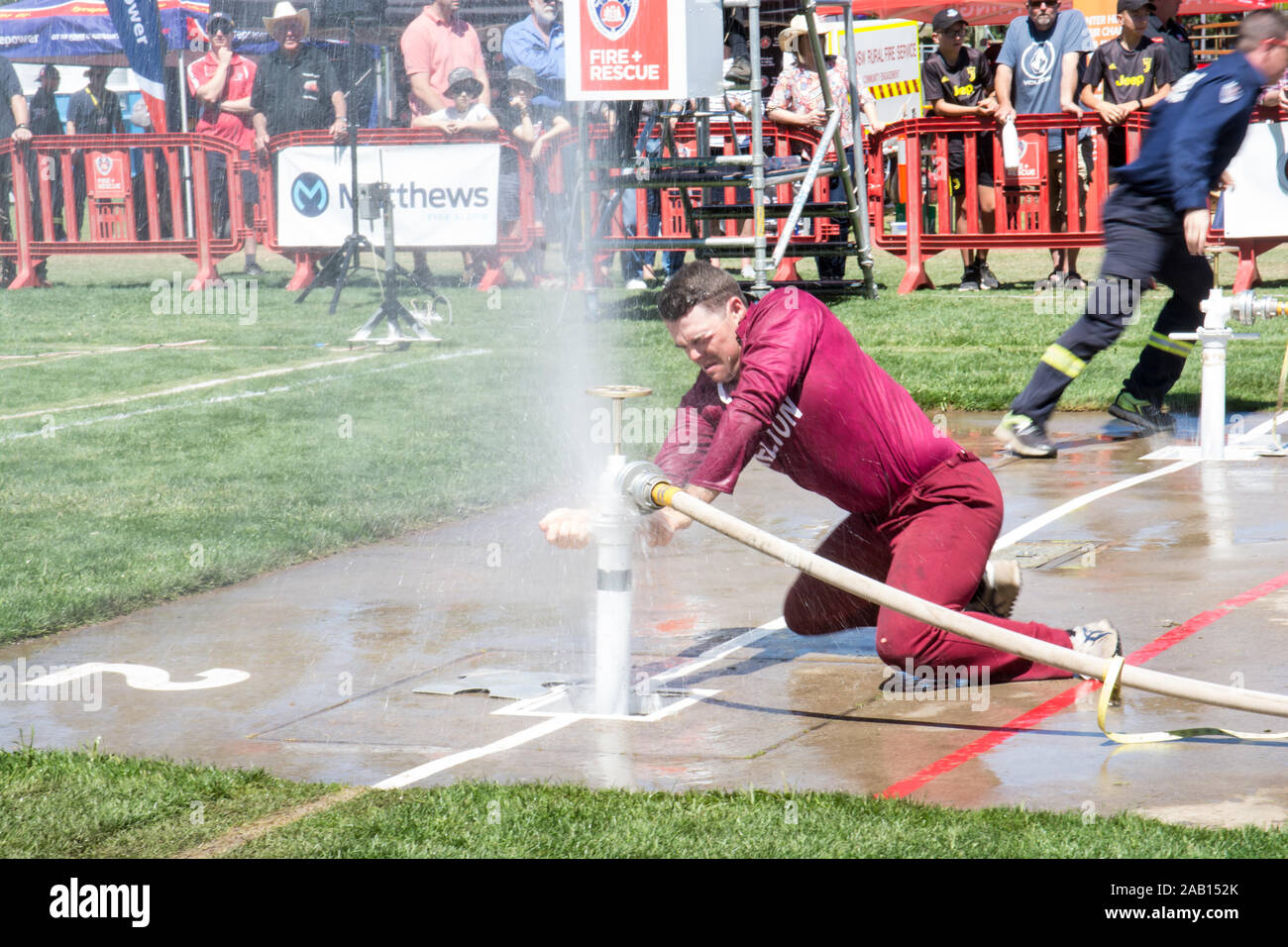 Fireman at hydrant competing in Australian Firefighting Championships, Tamworth October 2019. Stock Photo