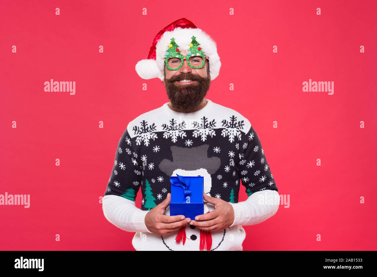 Holiday Gift Delivery Happy Santa Hold Christmas Gift Bearded Man Got Gift Red Background Holiday Gift Christmas And New Year Celebration Shopping Delivery Service Wrapped Box Present For Men Stock Photo